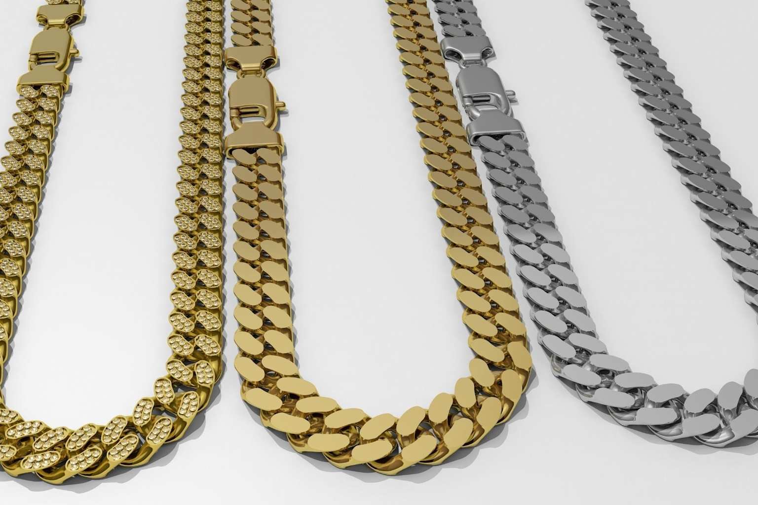 Various styles of Cuban link chains, including iced-out and classic solid designs in different metal tones, showcasing popular variations and craftsmanship