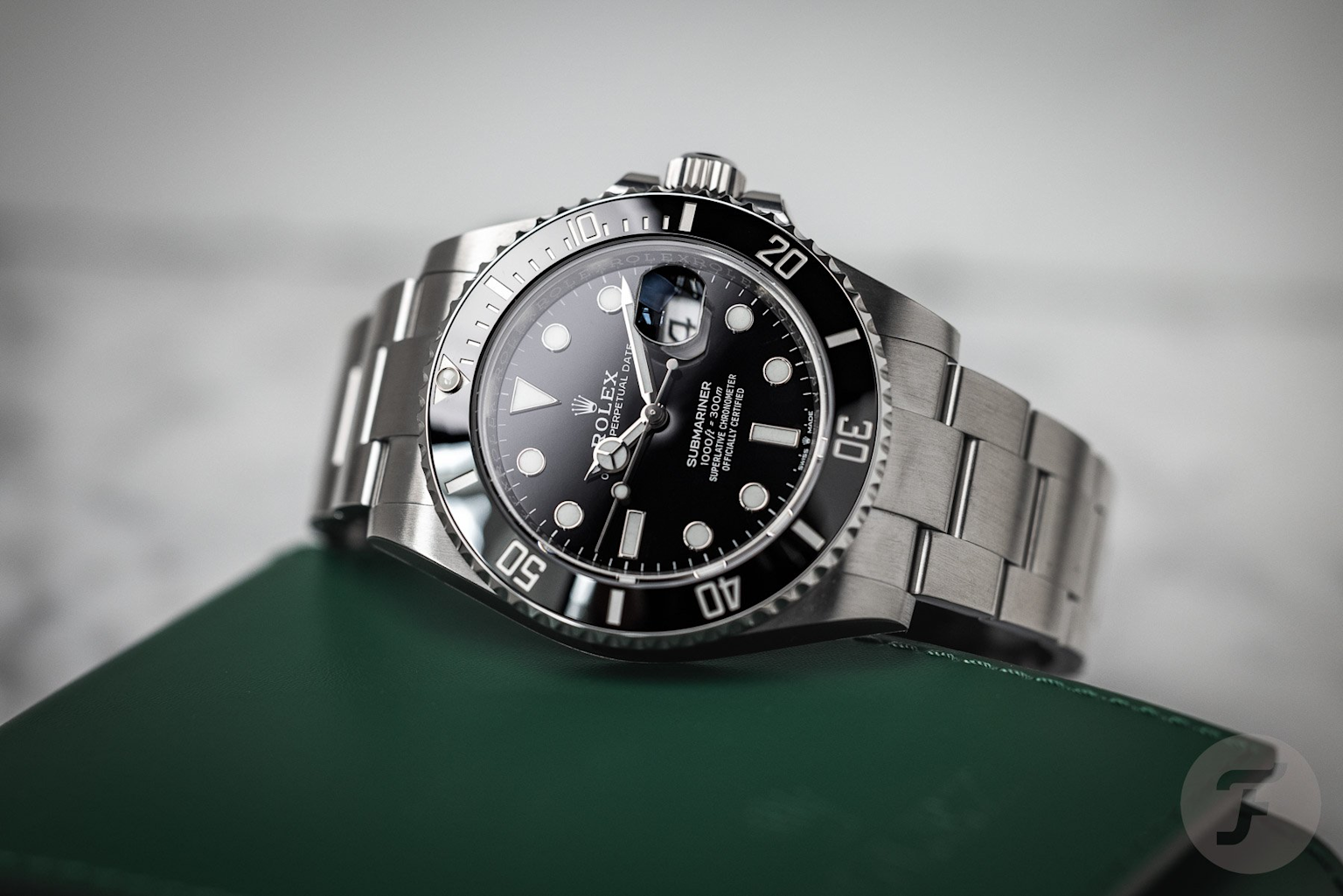 Close-up of the Rolex Submariner Date 126610LN highlighting the cyclops lens over the date window for enhanced legibility