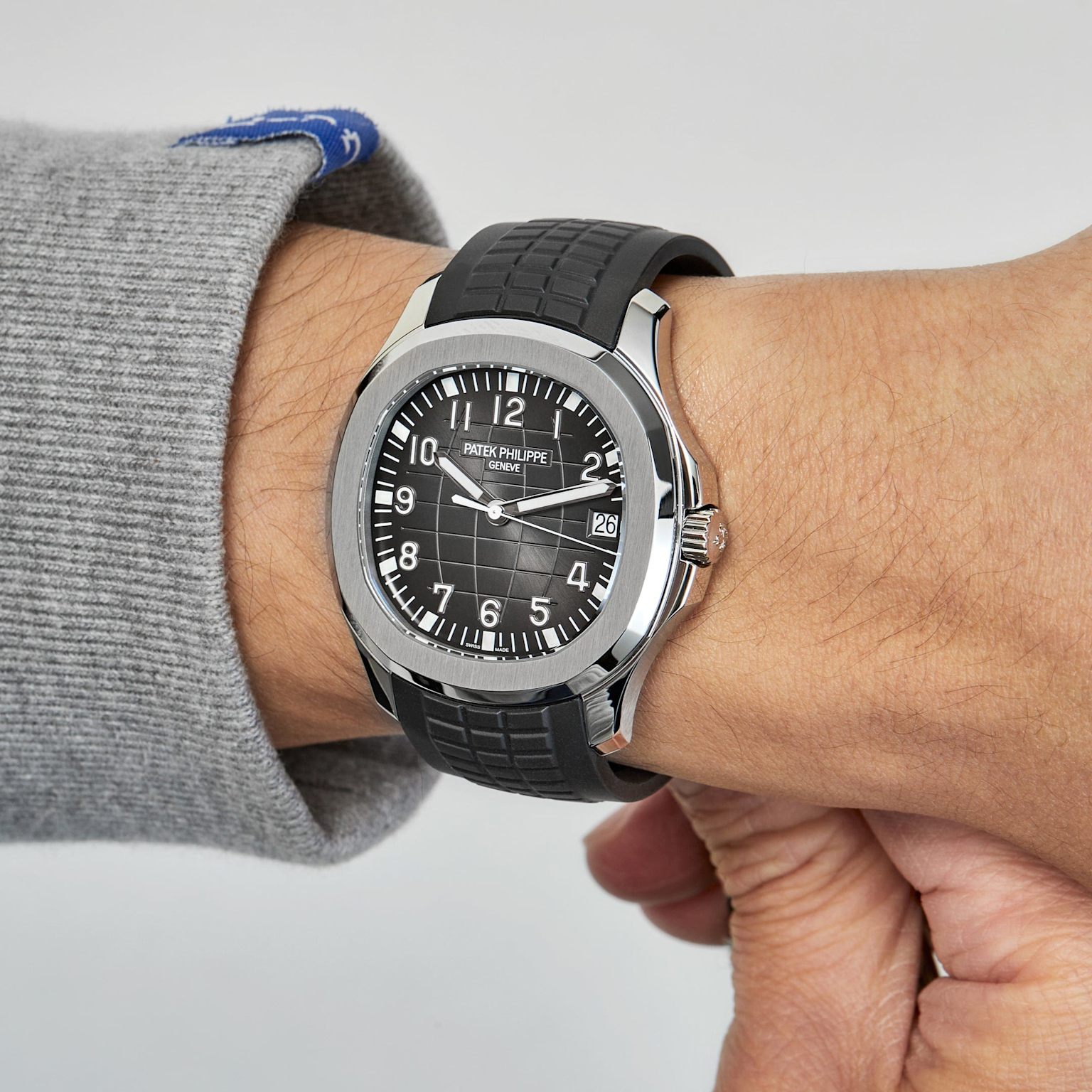 High-resolution photo of a Patek Philippe Aquanaut 5167A-001 with black dial and stainless steel case, showcasing a popular entry-level model for new collectors