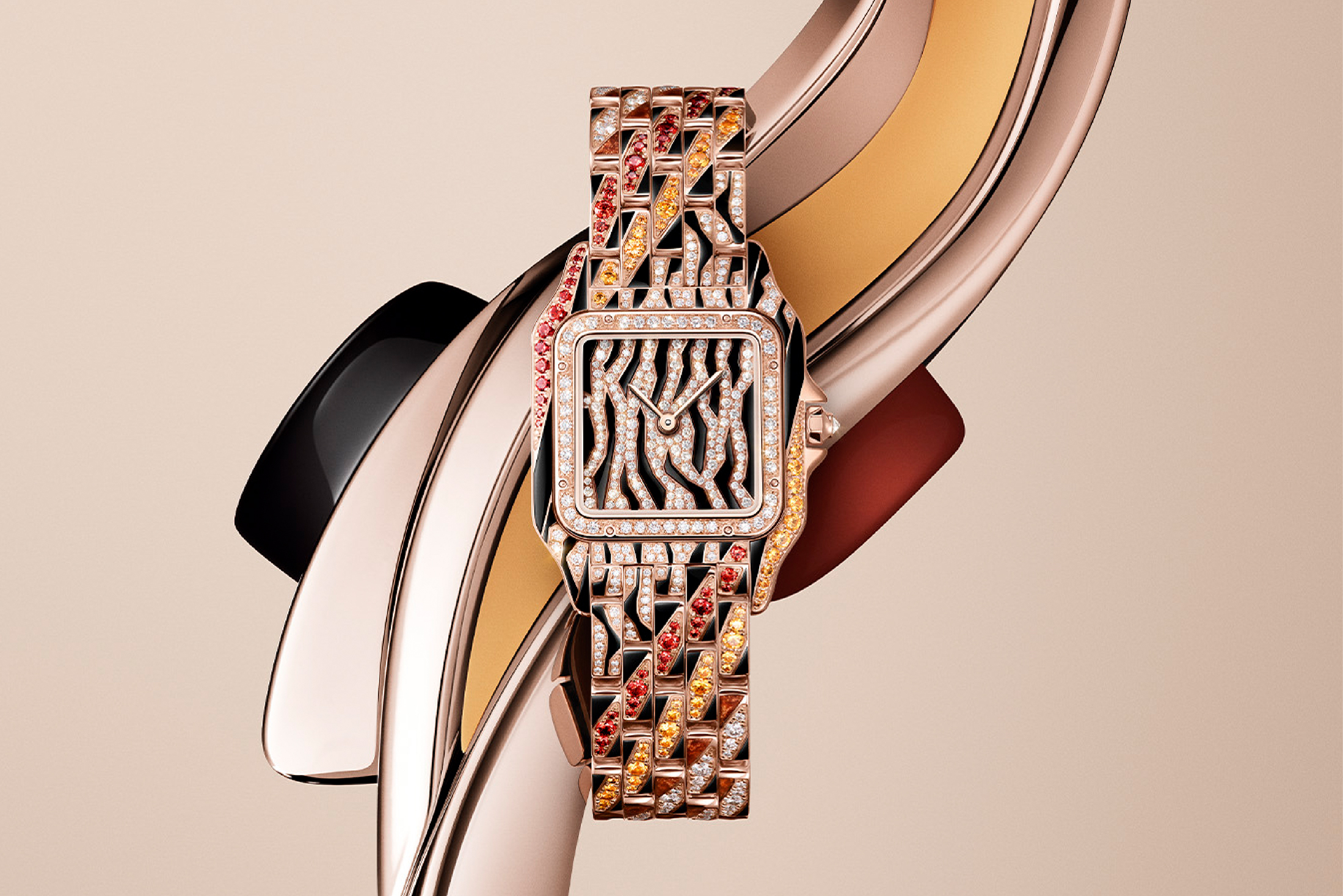 Cartier diamond watch with jungle motif, rose gold case, and multicolored gemstone bracelet.