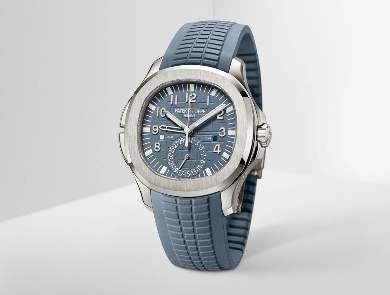 Patek Philippe Aquanaut Travel Time watch with blue dial and matching blue rubber strap