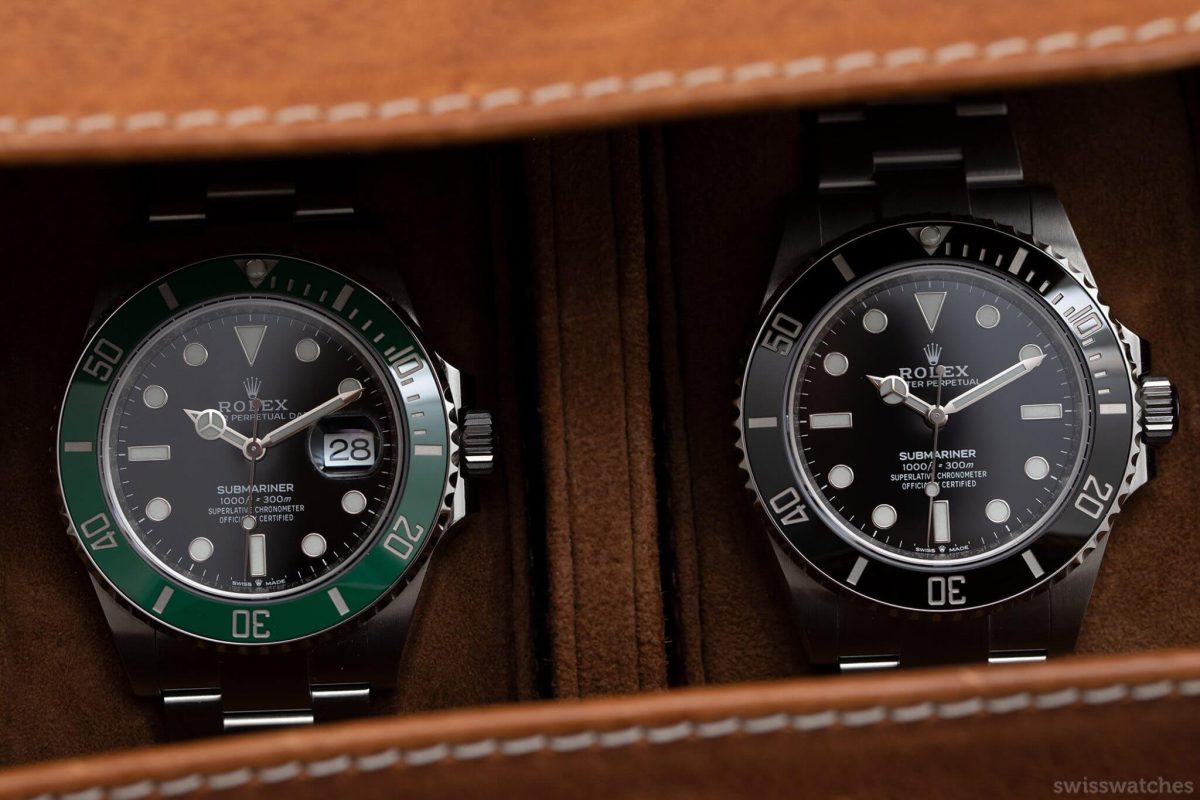 Rolex Submariner Date with green bezel and classic black Submariner side by side in a luxury watch case.