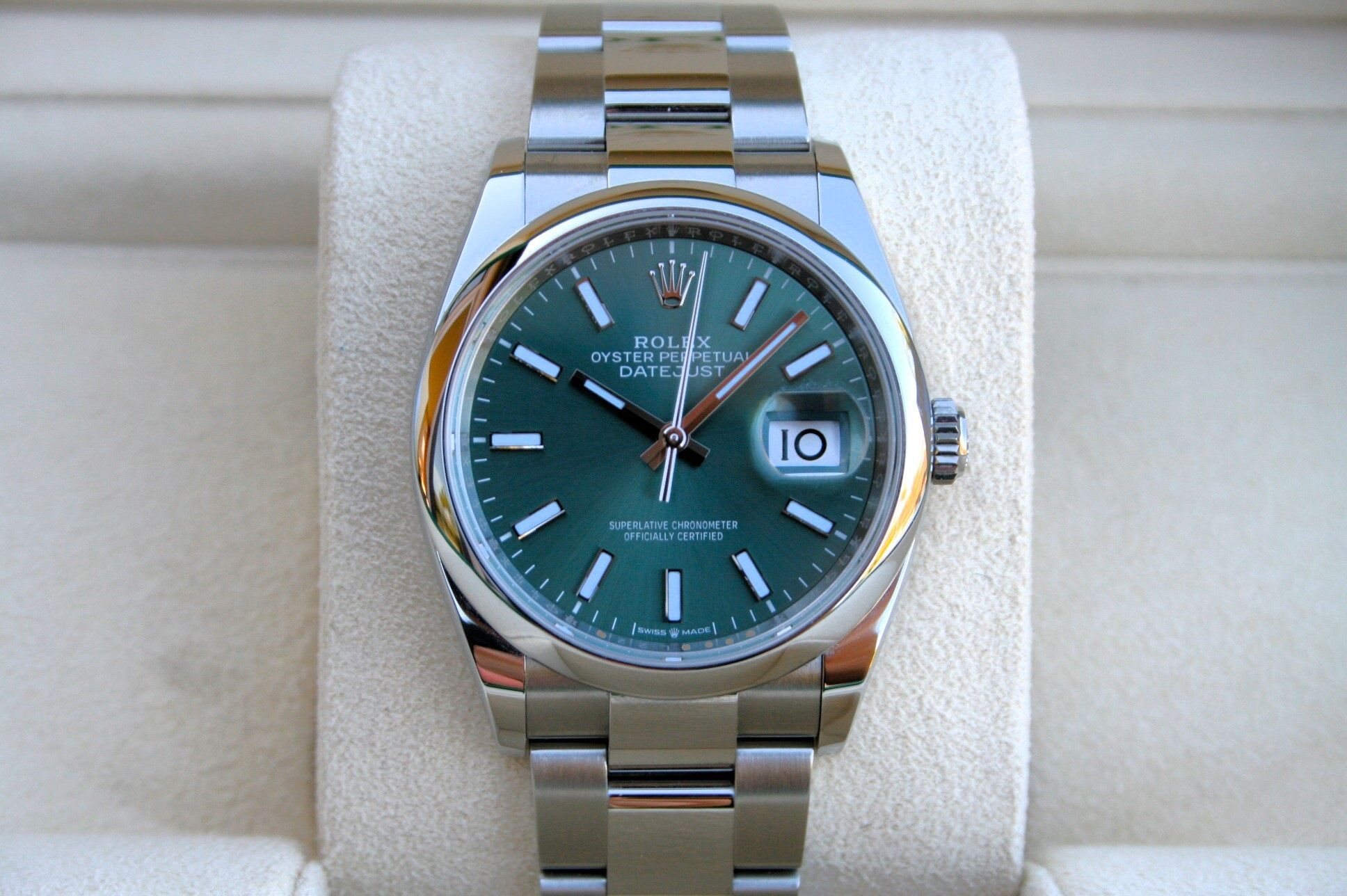 Rolex Datejust stainless steel with green dial and Oyster bracelet close-up