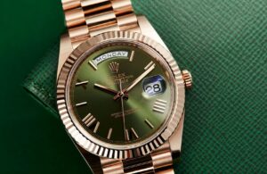 Rolex Day-Date Everose gold with green dial and fluted bezel close-up