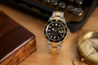 Rolex Submariner two-tone steel and yellow gold with black dial and bezel on Oyster bracelet