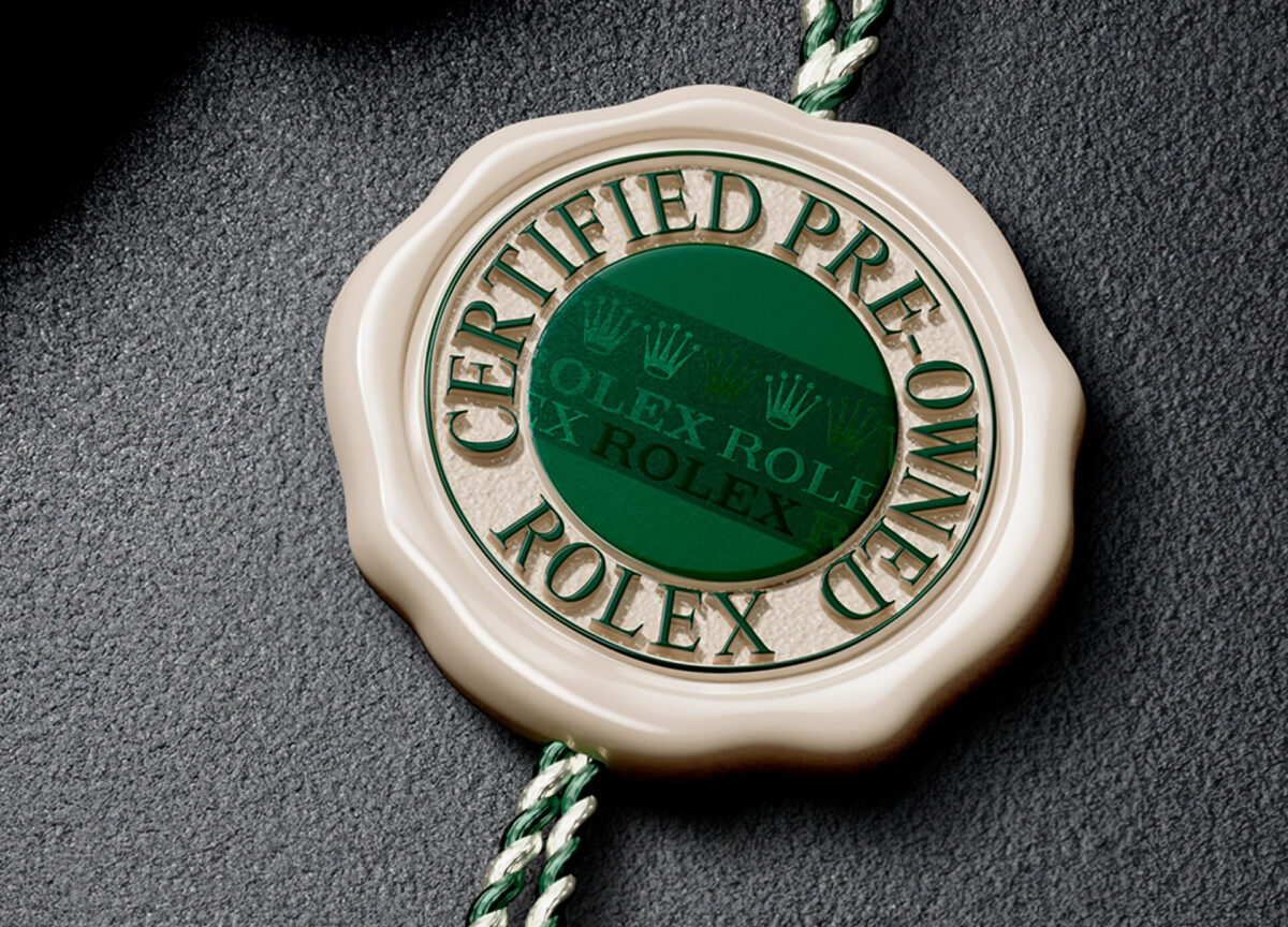 Rolex Certified Pre-Owned seal with green medallion and braided tag, official authenticity emblem